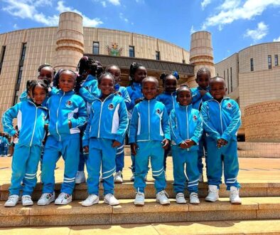 Learners in school tracksuits on a leadership visit