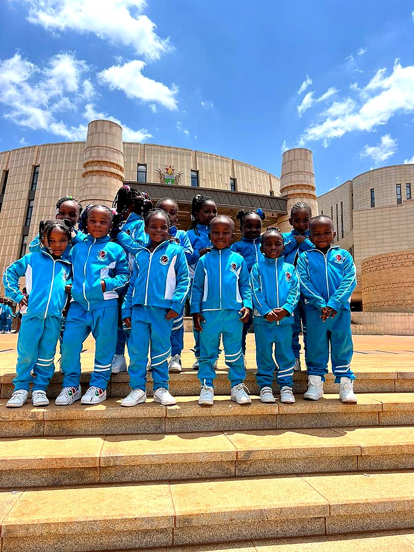 Learners in school tracksuits on a leadership visit